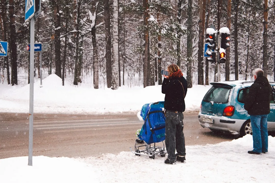 a couple of people that are standing in the snow