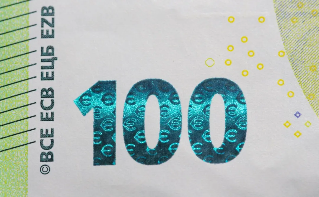 A paper bill with the number ten on it